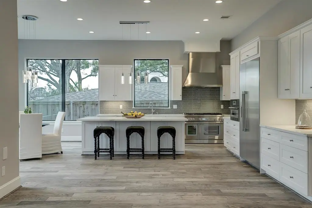Kitchen with open shelving and range hood